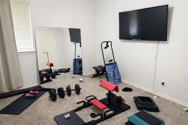 a room with furniture and a flat screen tv