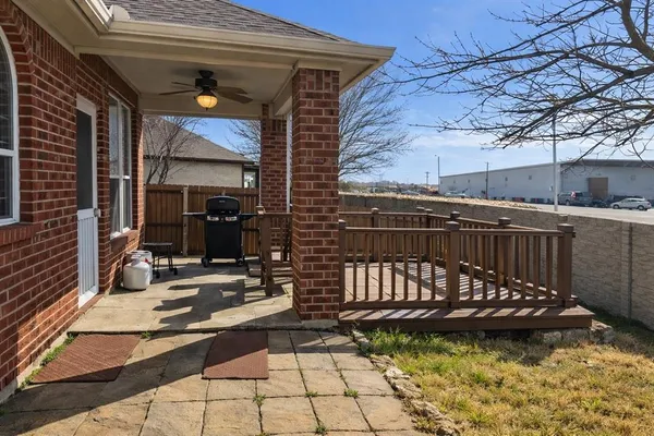 a view of a patio with a table and chairs