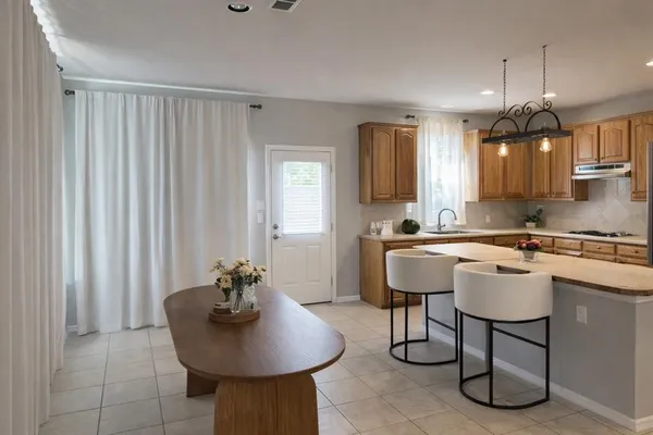 a kitchen with a sink cabinets and window