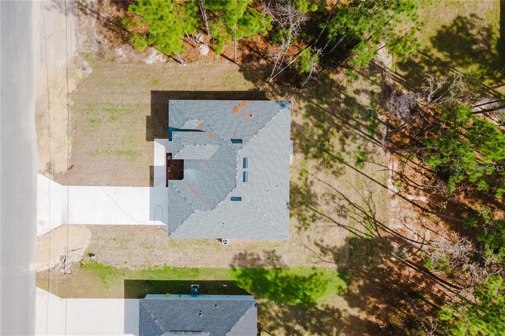 6732 Southwest 132nd Street Ocala, FL 34473 - Photo 33 of 36 an aerial view of residential houses with outdoor space