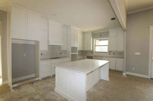 a kitchen with a sink stove and refrigerator