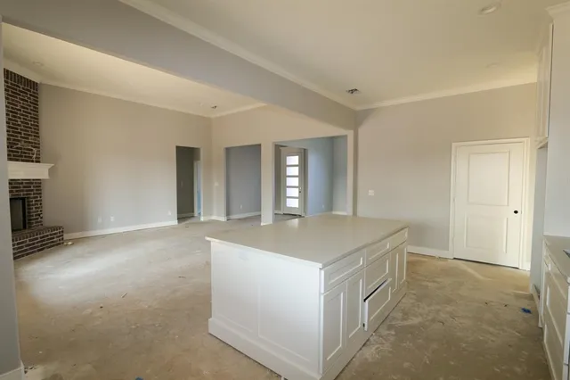 a kitchen with a stove and a refrigerator