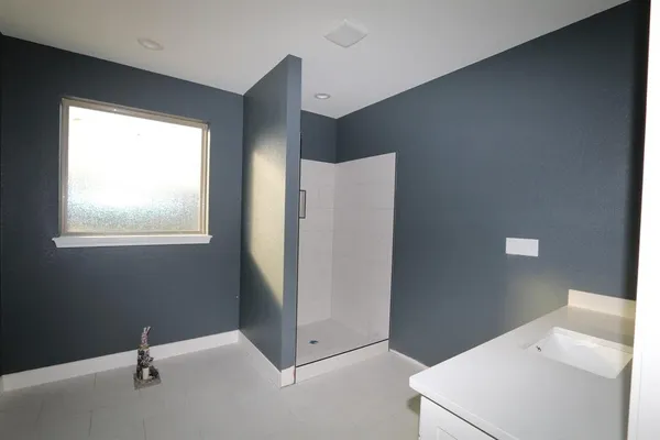 a view of an empty room with windows