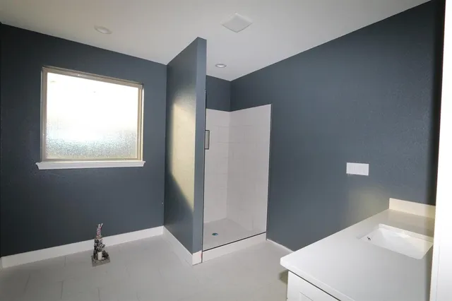 a view of an empty room with windows