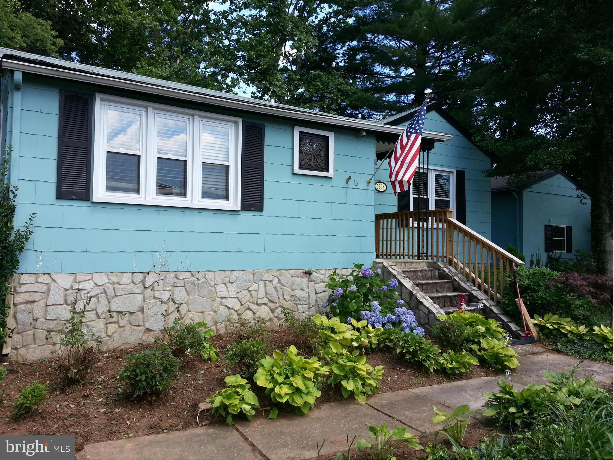 5308 Forge Road White Marsh, MD 21162 - Photo 1 of 26 a front view of a house with a yard