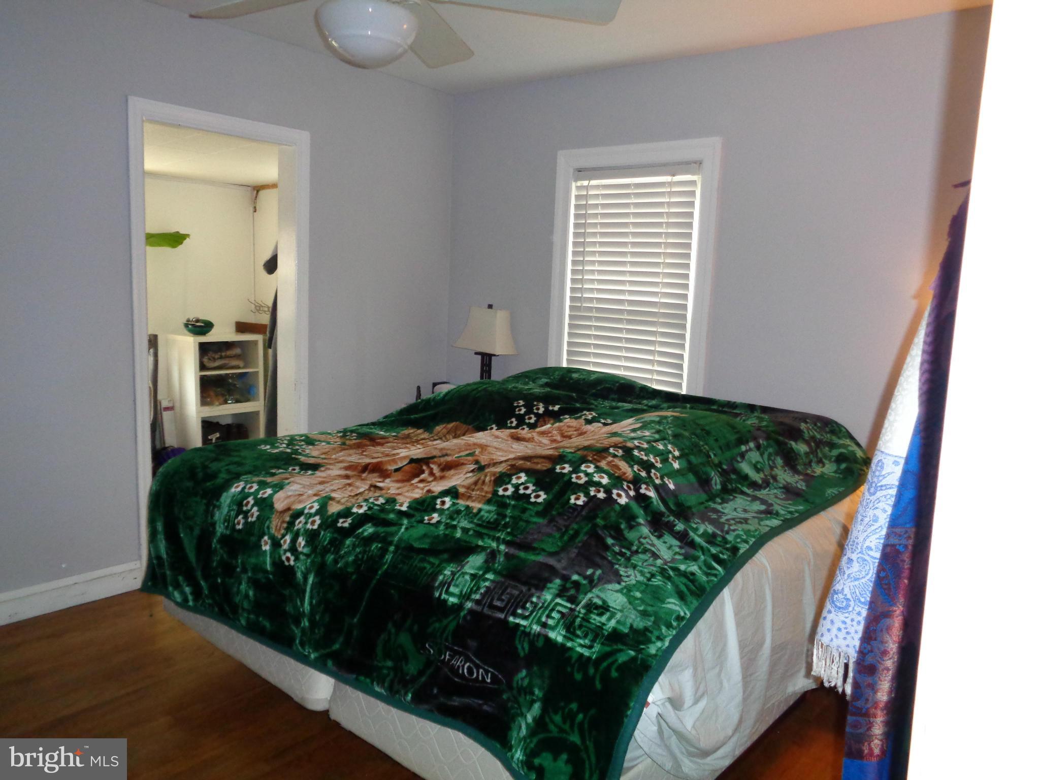 5308 Forge Road White Marsh, MD 21162 - Photo 17 of 26 a bed sitting in a bedroom next to a window