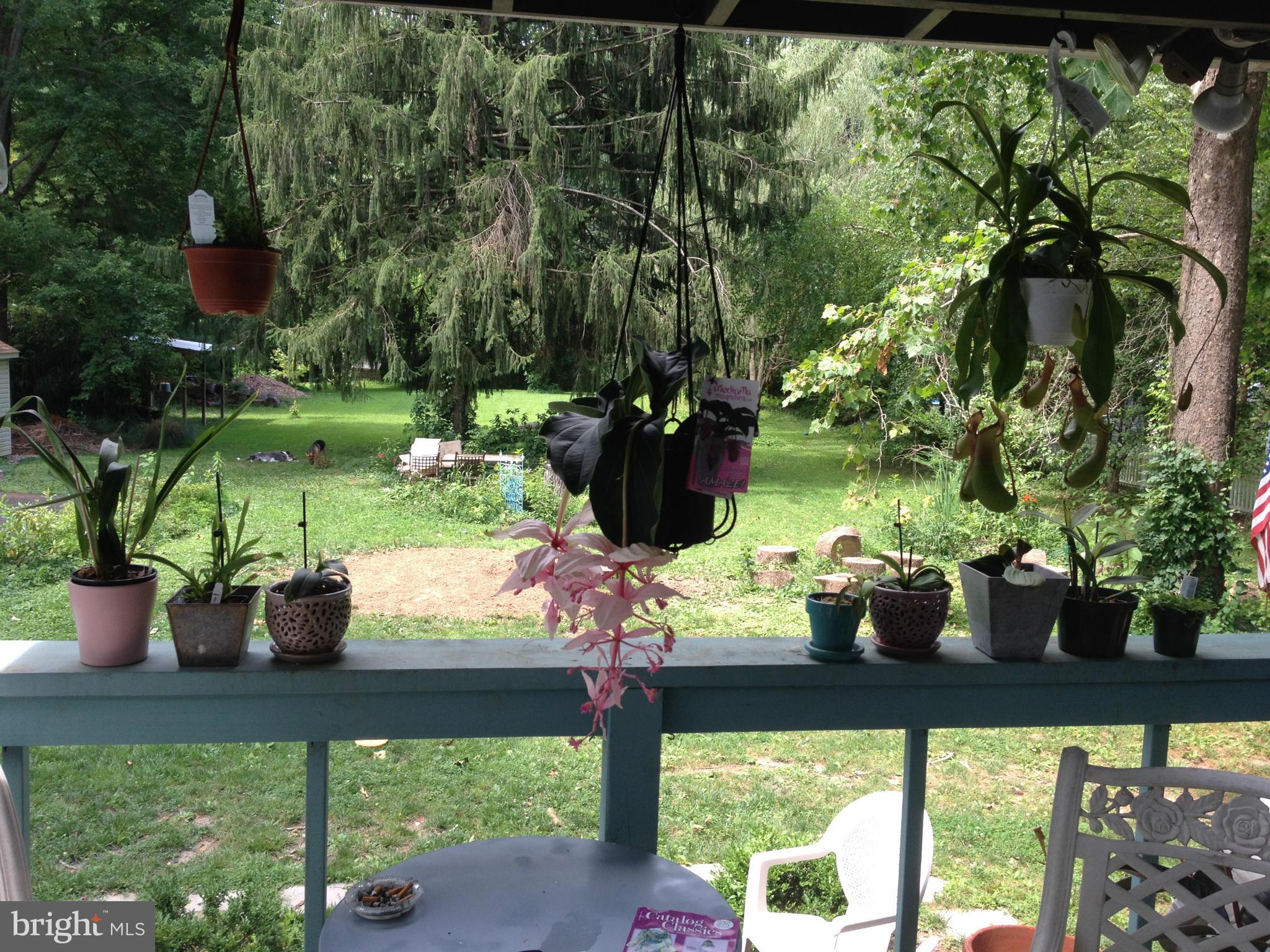 5308 Forge Road White Marsh, MD 21162 - Photo 20 of 26 a view of a porch with chairs and potted plants