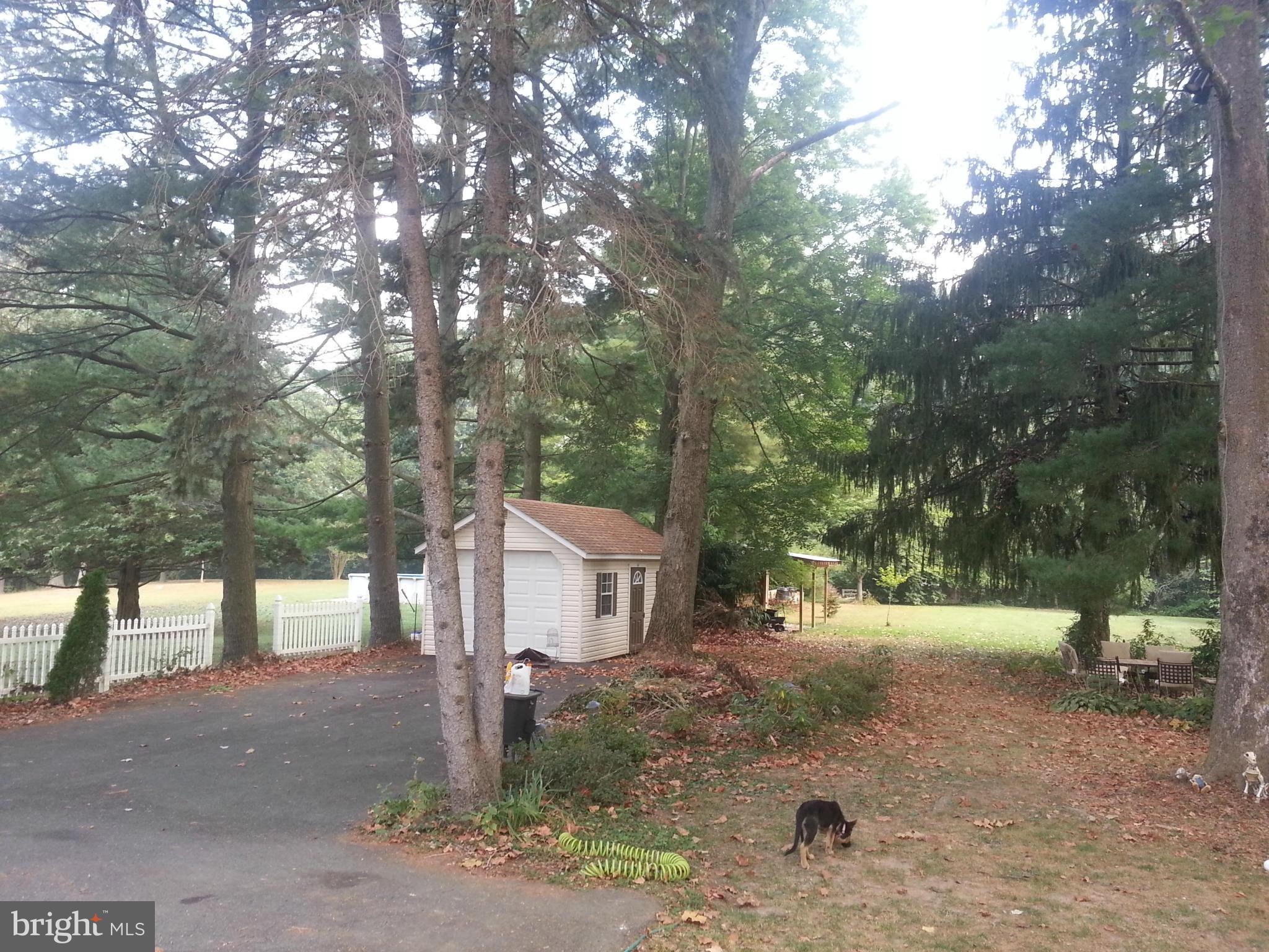 5308 Forge Road White Marsh, MD 21162 - Photo 23 of 26 a view of a house with a yard and tree s