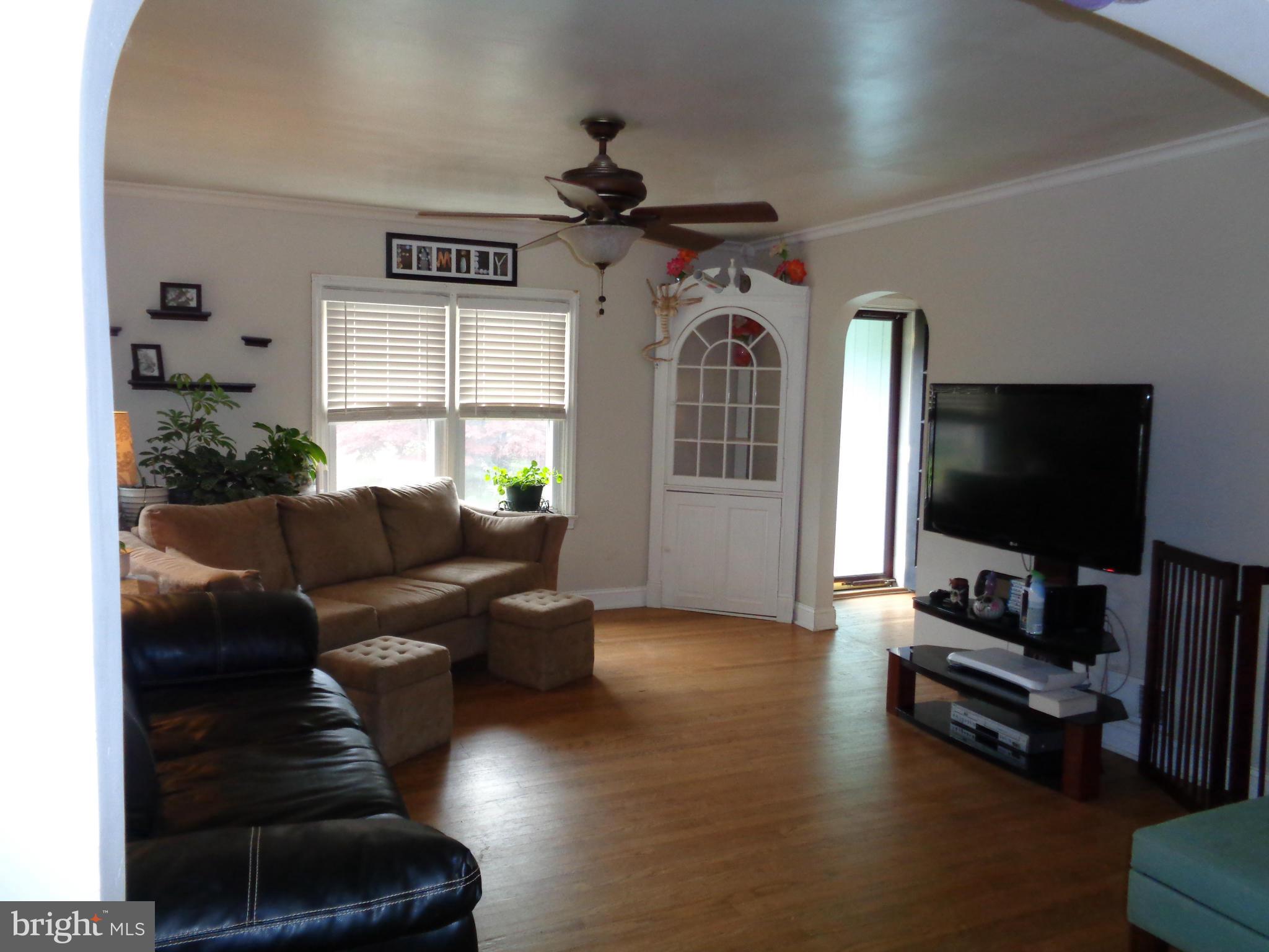 5308 Forge Road White Marsh, MD 21162 - Photo 5 of 26 a living room with furniture and a flat screen tv
