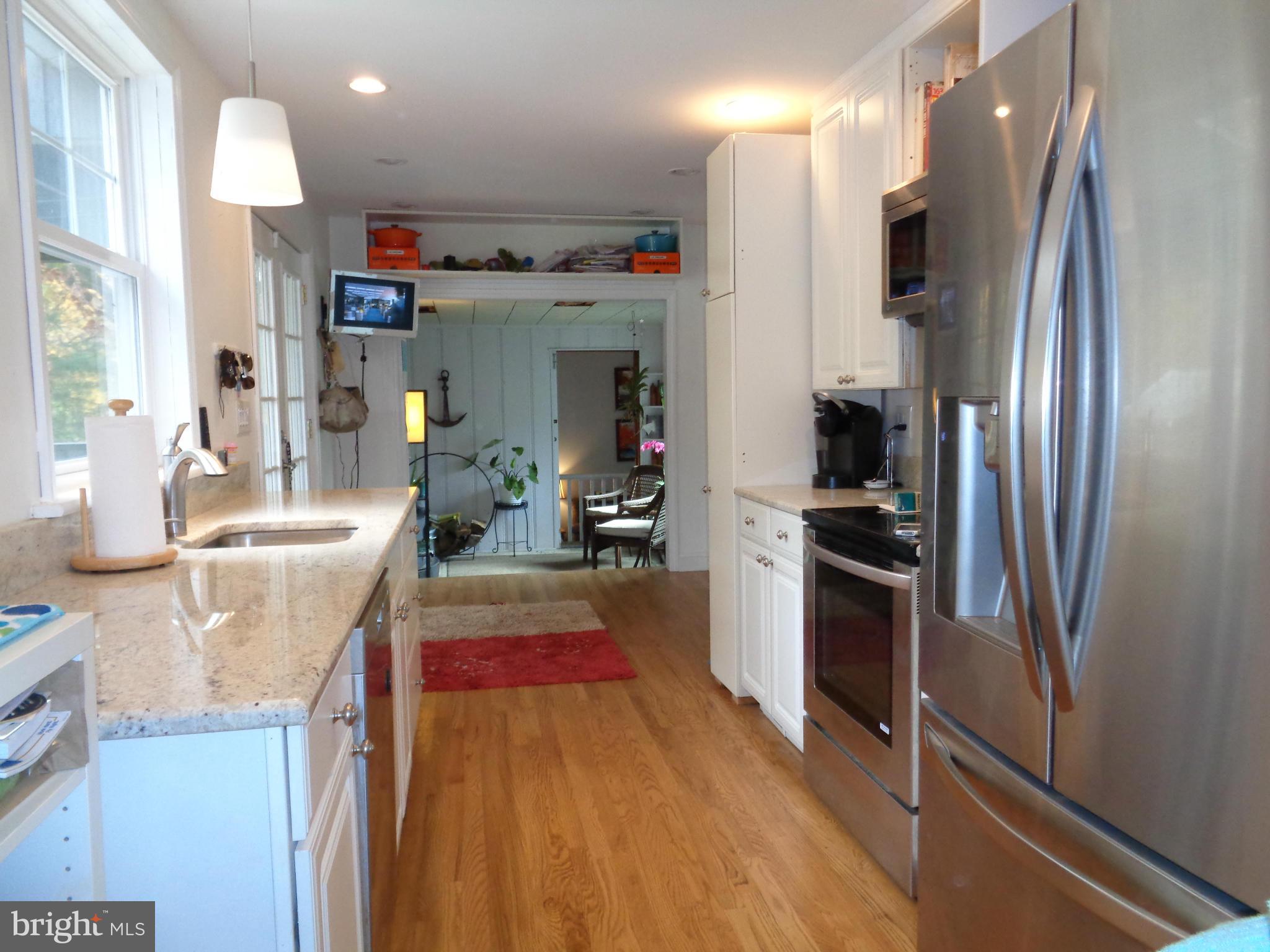 5308 Forge Road White Marsh, MD 21162 - Photo 7 of 26 a kitchen with refrigerator and window