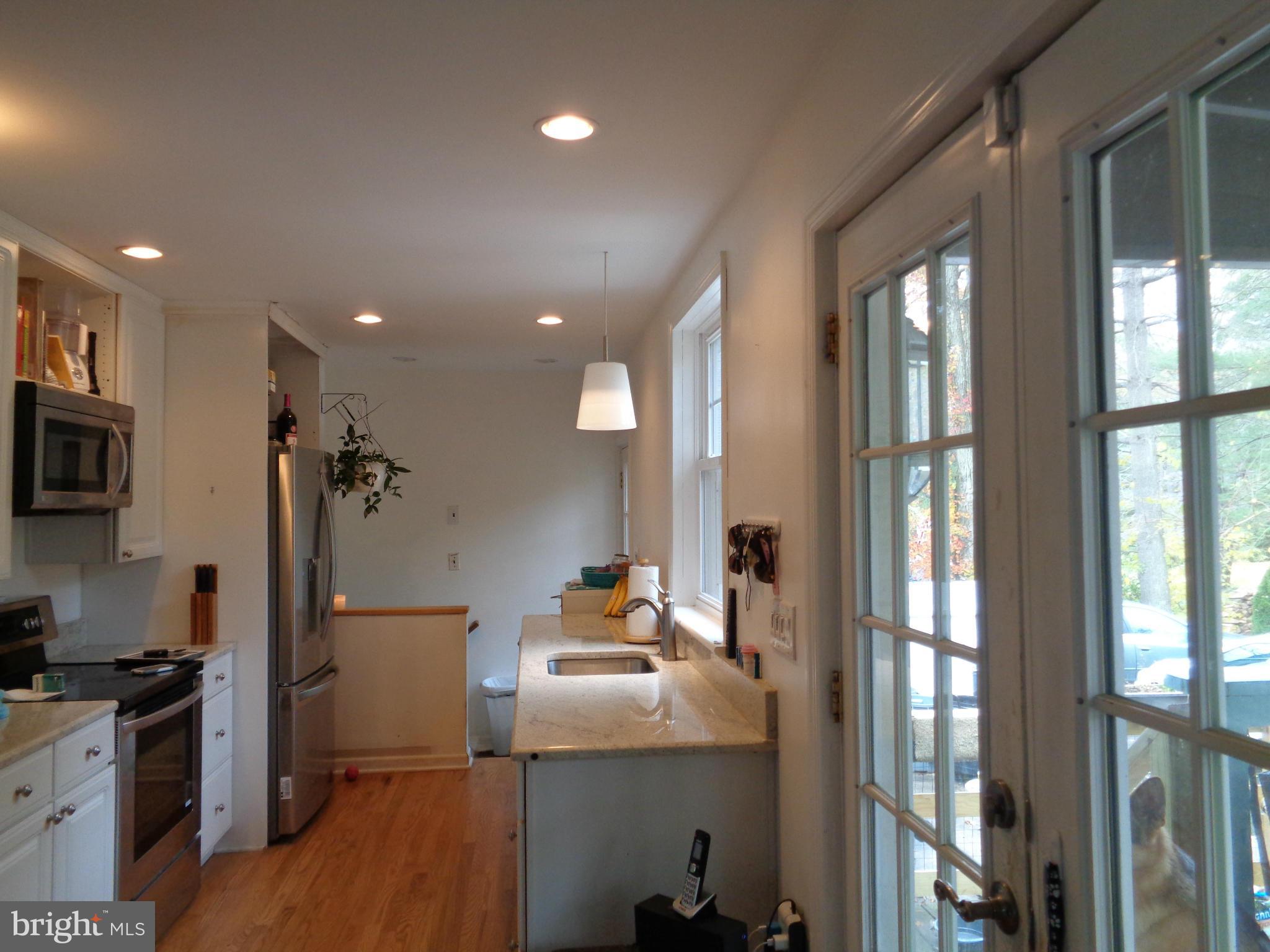 5308 Forge Road White Marsh, MD 21162 - Photo 9 of 26 a view of a kitchen with a sink and refrigerator