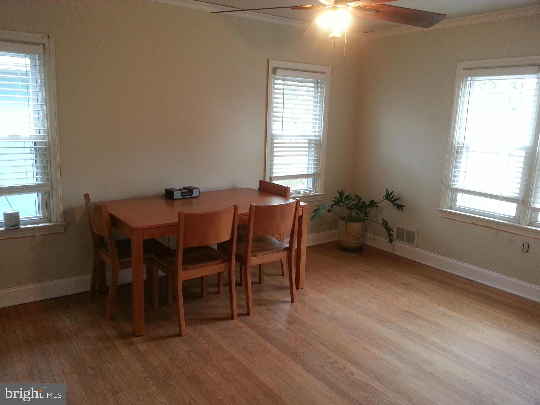 5308 Forge Road White Marsh, MD 21162 - Photo 10 of 26 a dining room with furniture and wooden floor