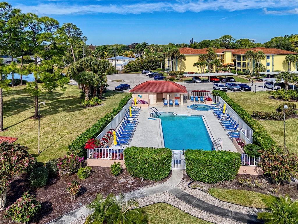 1001 Foxfire Lane, Unit 307 Naples, FL 34104 - Photo 20 of 23 a aerial view of a house with a yard basket ball court and outdoor seating