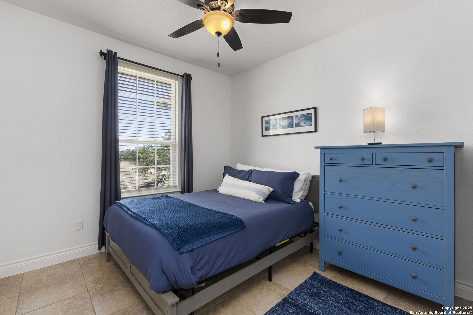 1608 Lake Ridge Boulevard Canyon Lake, TX 78133 - Photo 19 of 46 a bedroom with a bed and a window