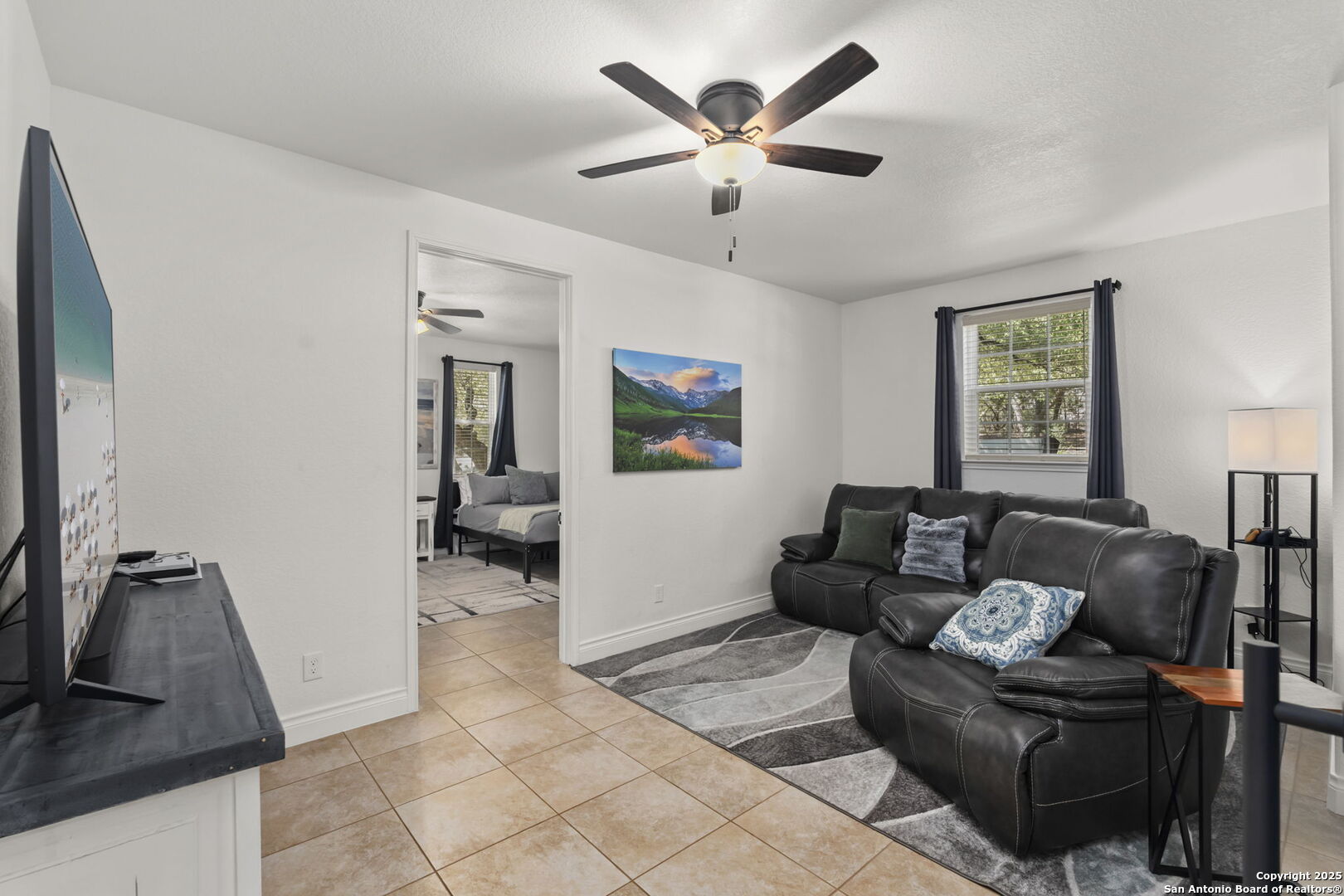 1608 Lake Ridge Boulevard Canyon Lake, TX 78133 - Photo 20 of 46 a living room with furniture and a flat screen tv