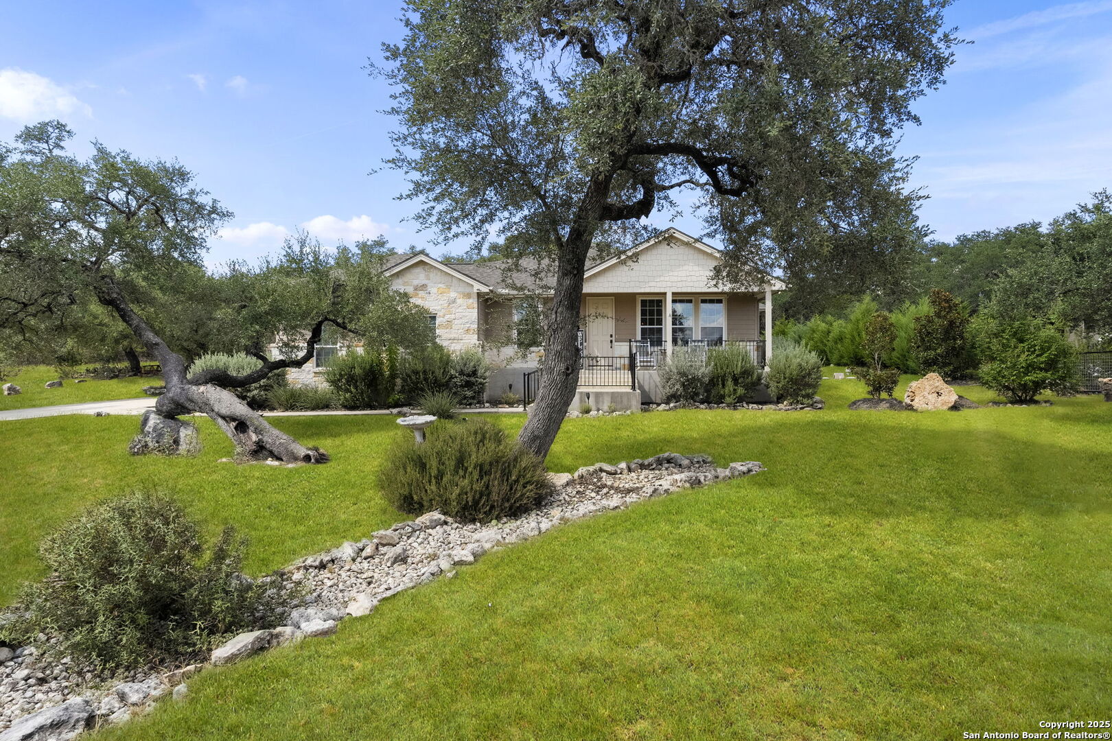 1608 Lake Ridge Boulevard Canyon Lake, TX 78133 - Photo 2 of 46 a front view of house with yard and green space