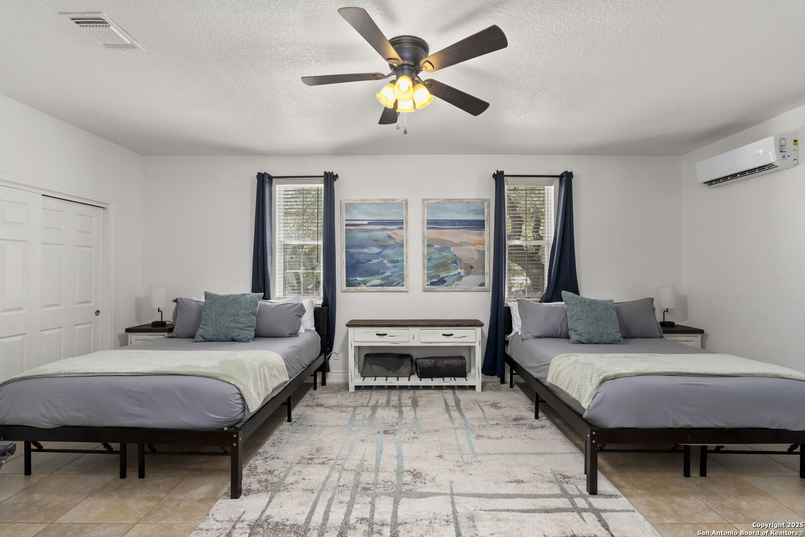 1608 Lake Ridge Boulevard Canyon Lake, TX 78133 - Photo 22 of 46 a bedroom with a bed and a large window