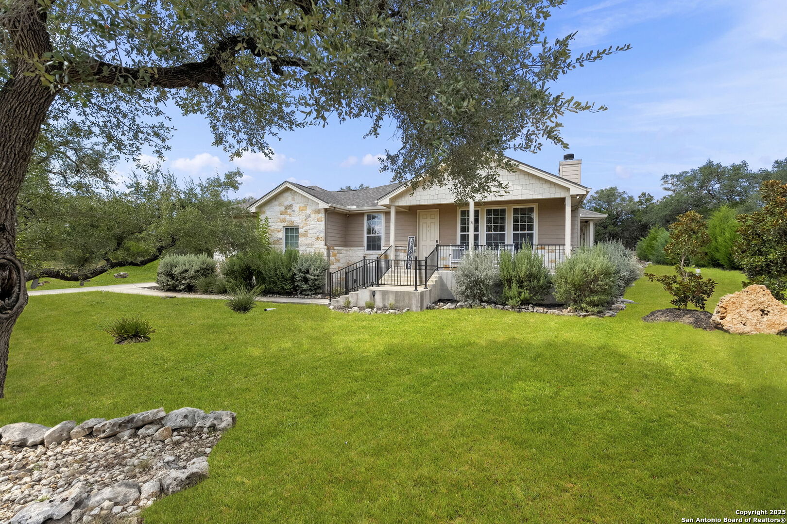 1608 Lake Ridge Boulevard Canyon Lake, TX 78133 - Photo 3 of 46 a front view of a house with garden