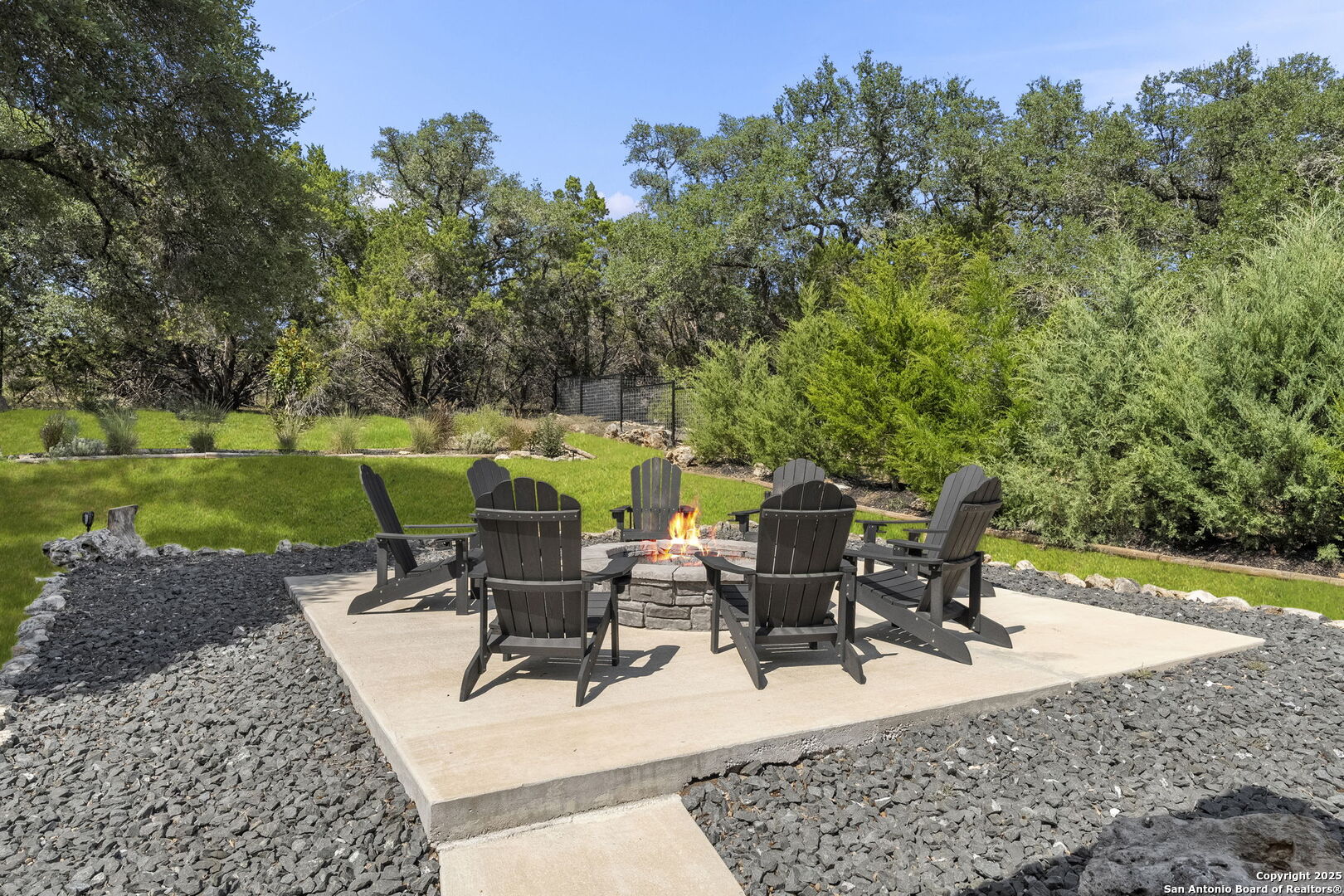1608 Lake Ridge Boulevard Canyon Lake, TX 78133 - Photo 38 of 46 a view of a backyard with sitting area