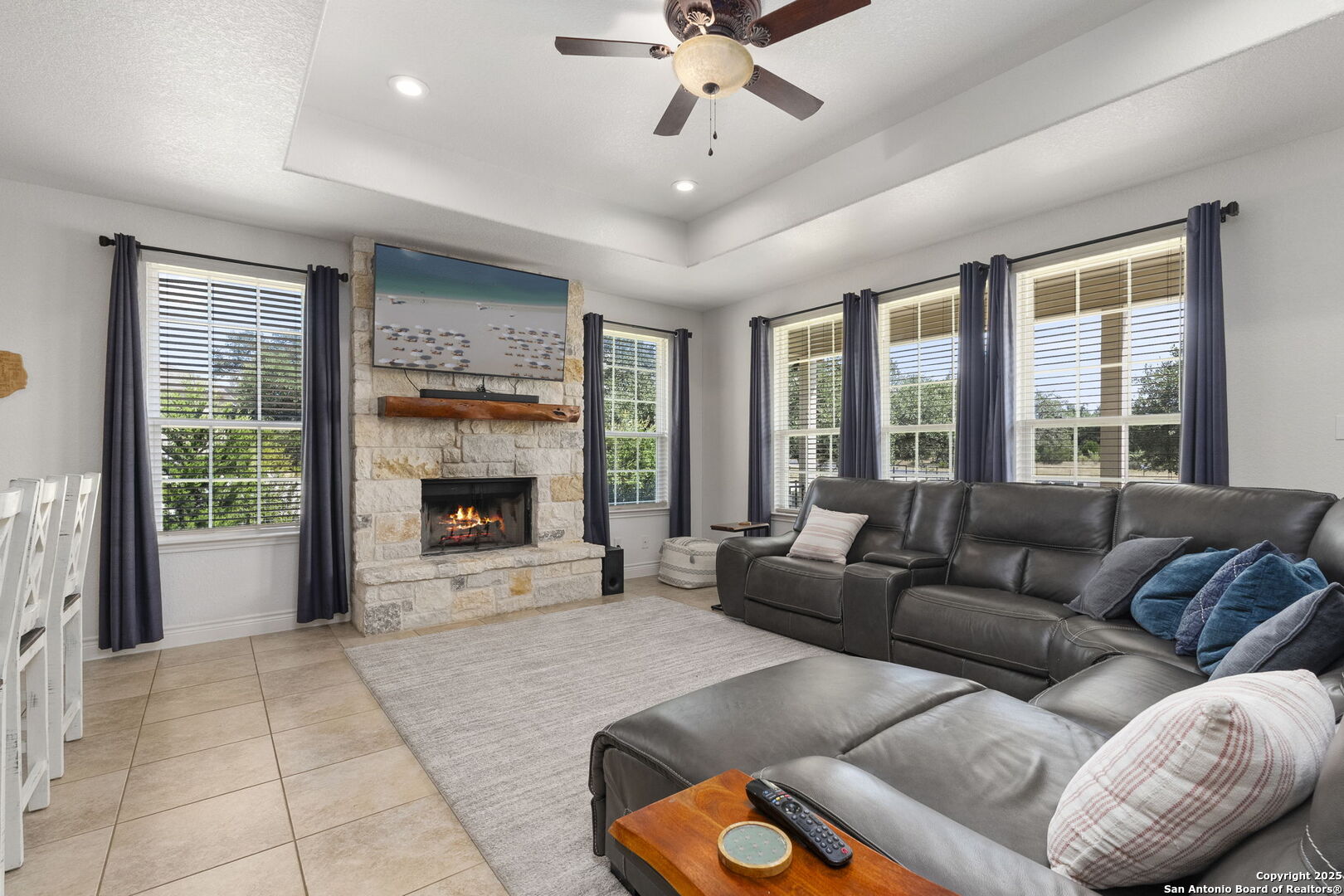 1608 Lake Ridge Boulevard Canyon Lake, TX 78133 - Photo 4 of 46 a living room with furniture and a fireplace