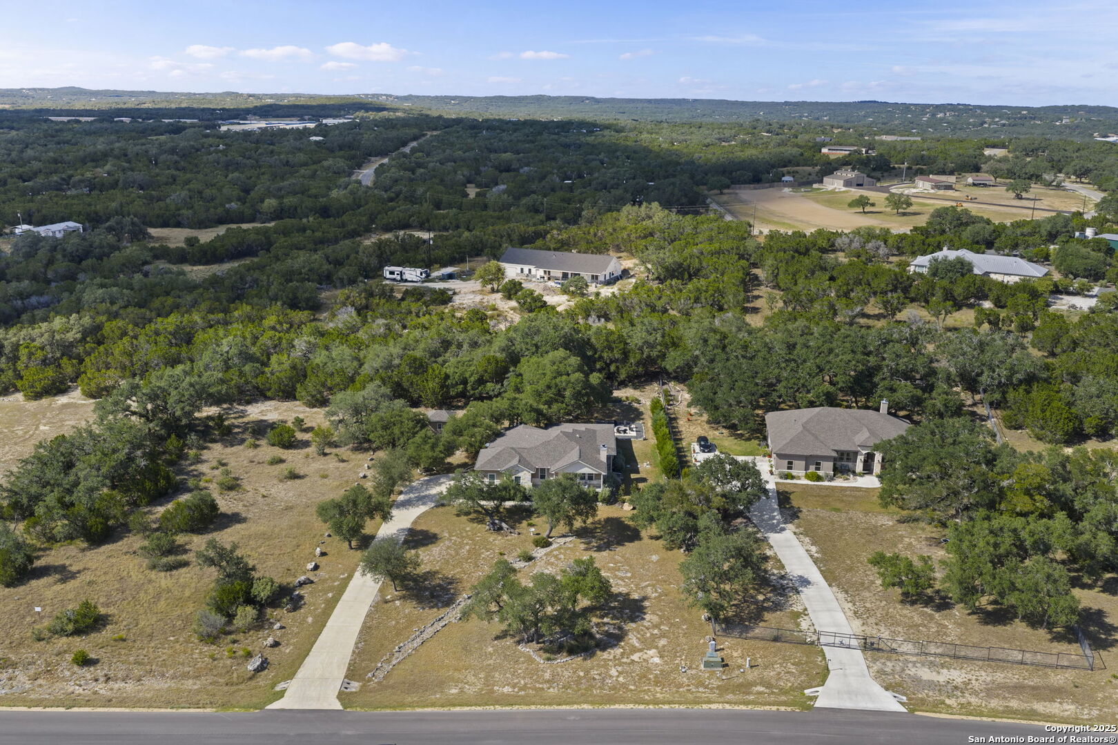 1608 Lake Ridge Boulevard Canyon Lake, TX 78133 - Photo 42 of 46 an aerial view of residential houses with outdoor space