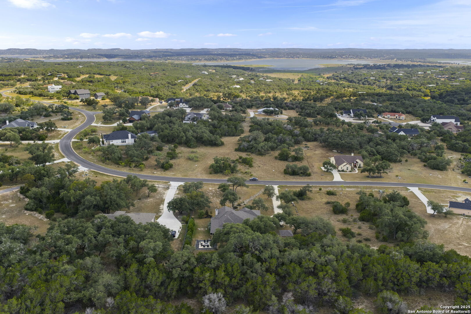 1608 Lake Ridge Boulevard Canyon Lake, TX 78133 - Photo 43 of 46 an aerial view of residential houses with outdoor space and trees