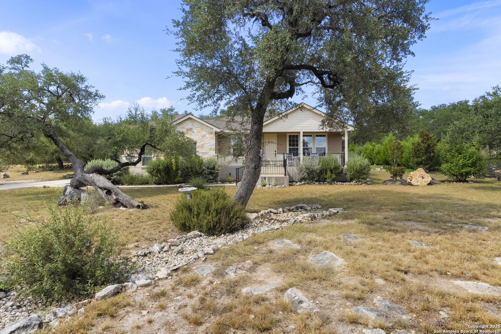 1608 Lake Ridge Boulevard Canyon Lake, TX 78133 - Photo 46 of 46 a front view of a house with a yard