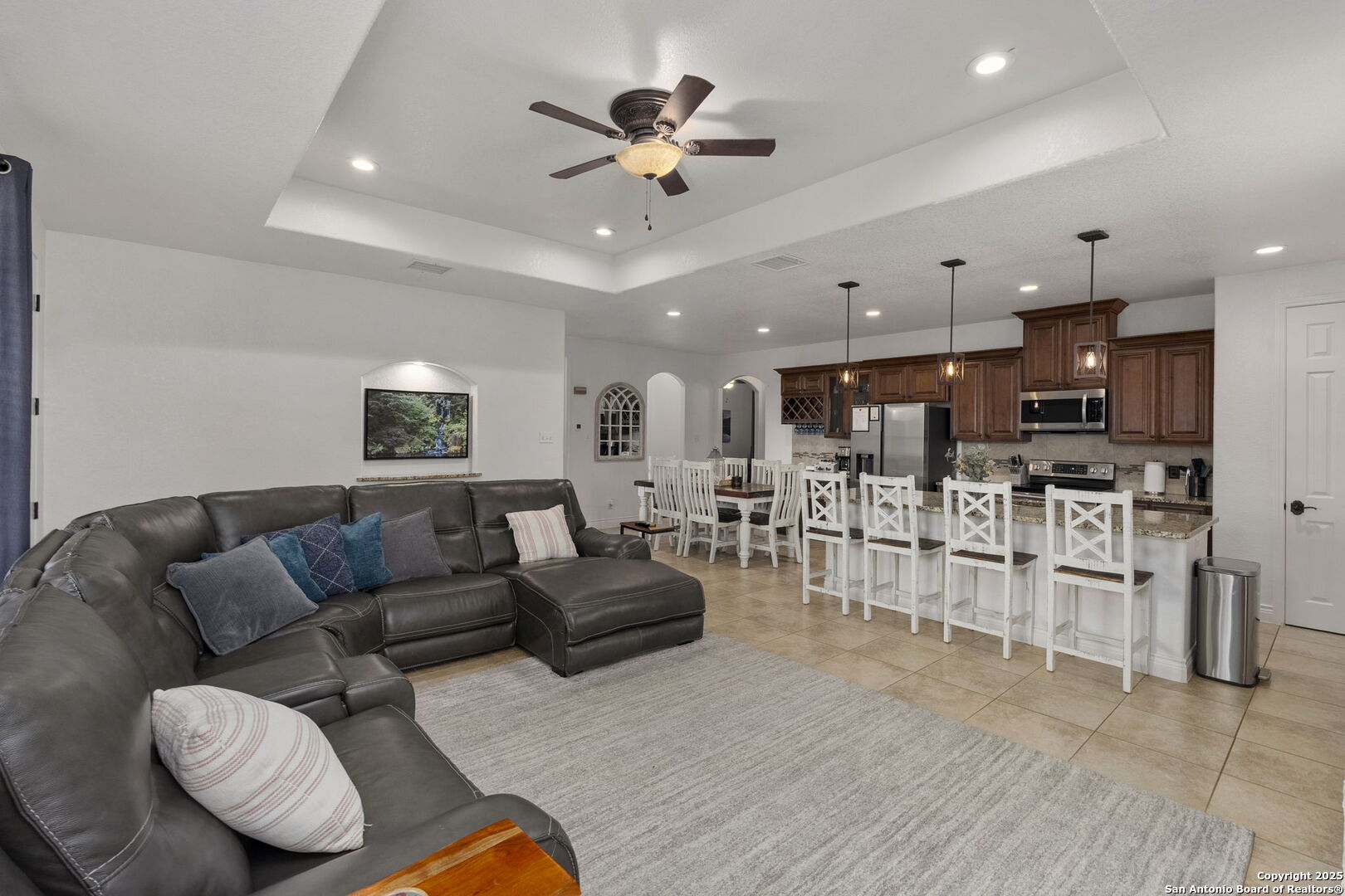 1608 Lake Ridge Boulevard Canyon Lake, TX 78133 - Photo 5 of 46 a living room with furniture kitchen view and a chandelier