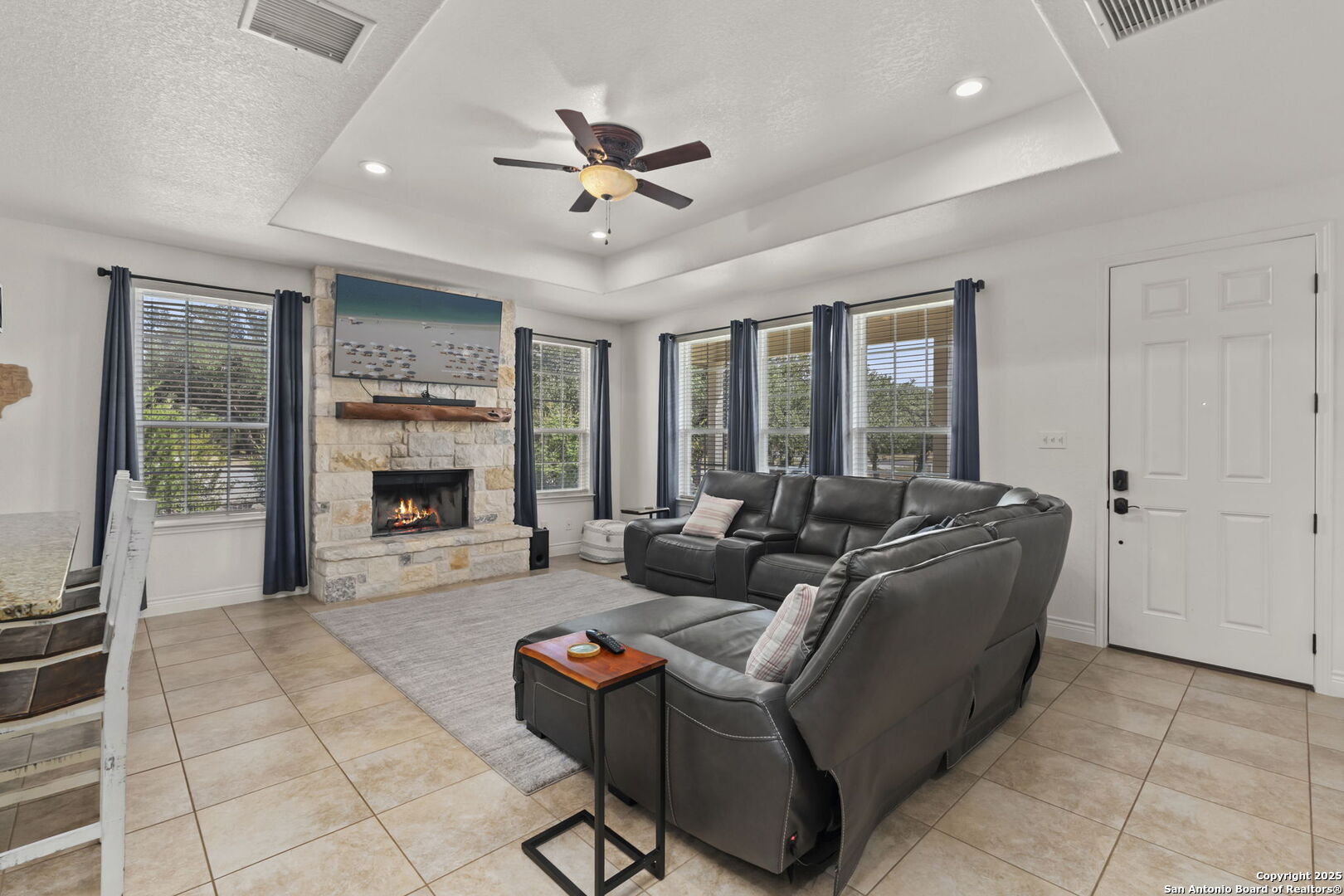1608 Lake Ridge Boulevard Canyon Lake, TX 78133 - Photo 6 of 46 a living room with furniture and a fireplace