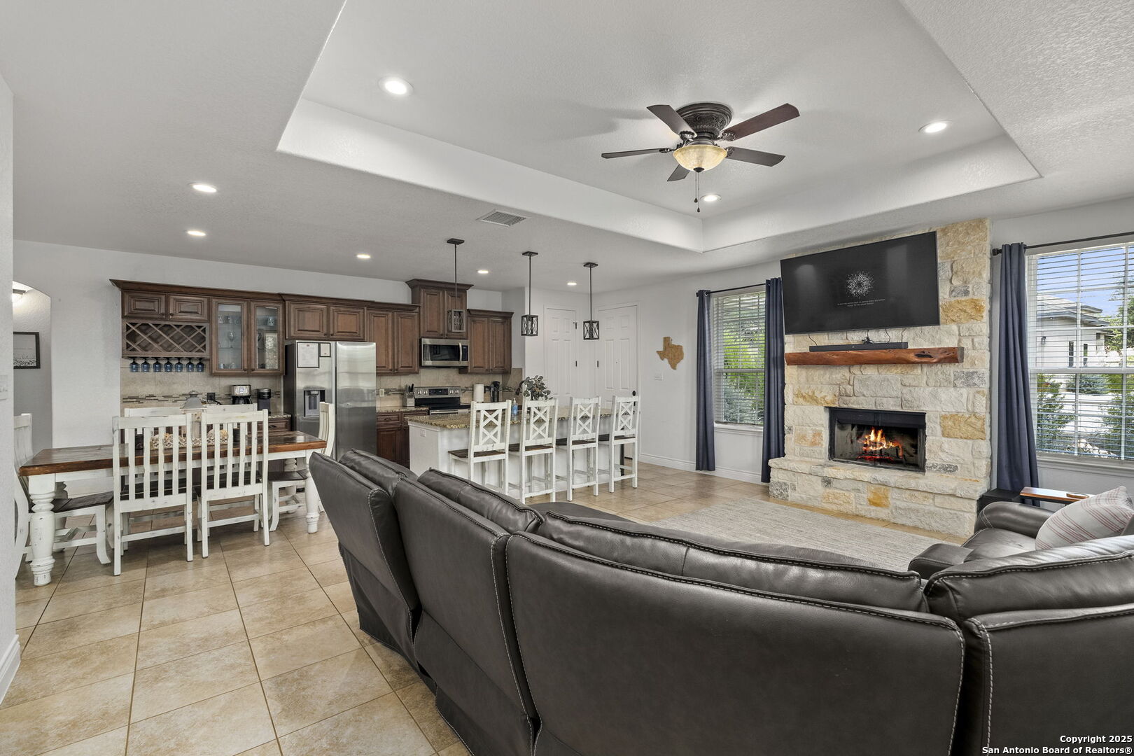 1608 Lake Ridge Boulevard Canyon Lake, TX 78133 - Photo 8 of 46 a living room with furniture a flat screen tv and a ceiling fan