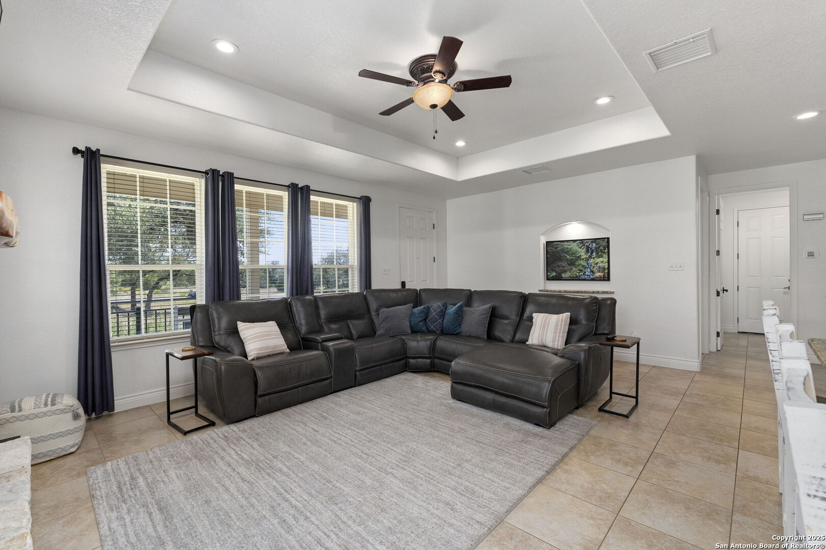 1608 Lake Ridge Boulevard Canyon Lake, TX 78133 - Photo 9 of 46 a living room with furniture and a ceiling fan