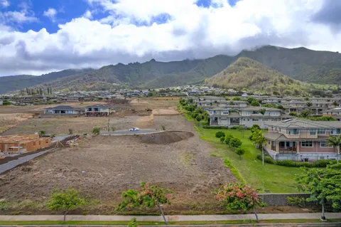 a view of a city street with a big yard