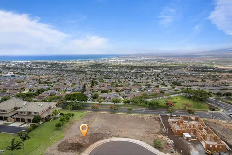 an aerial view of a city with mountains