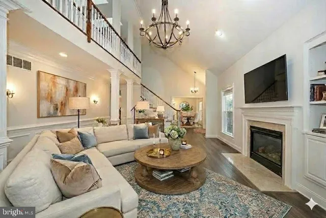 an aerial view of residential houses with outdoor space and swimming pool