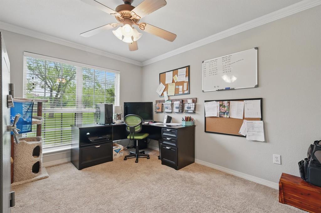 5657 Harmony Ranch Road Aubrey, TX 76227 - Photo 23 of 40 a view of a livingroom with workspace and a window