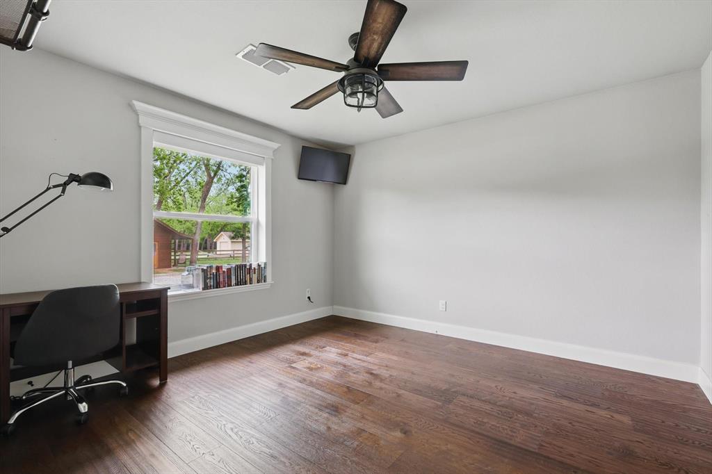 5657 Harmony Ranch Road Aubrey, TX 76227 - Photo 24 of 40 a view of room with workspace and a window
