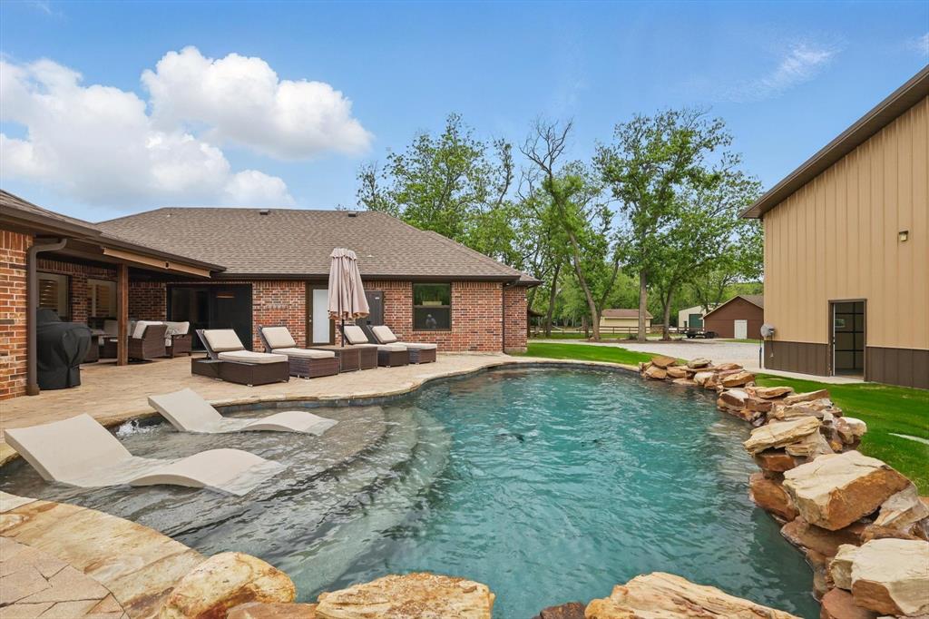 5657 Harmony Ranch Road Aubrey, TX 76227 - Photo 29 of 40 a view of a house with swimming pool and sitting area