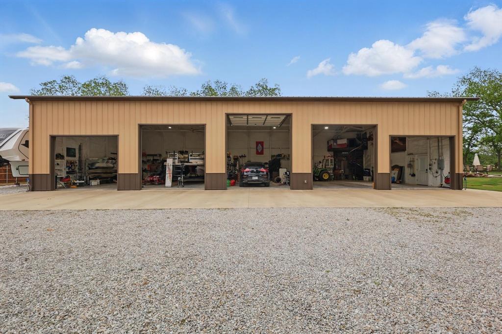 5657 Harmony Ranch Road Aubrey, TX 76227 - Photo 31 of 40 an outdoor space with furniture and garden view