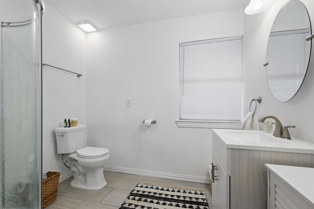 5657 Harmony Ranch Road Aubrey, TX 76227 - Photo 36 of 40 a bathroom with a sink toilet and shower