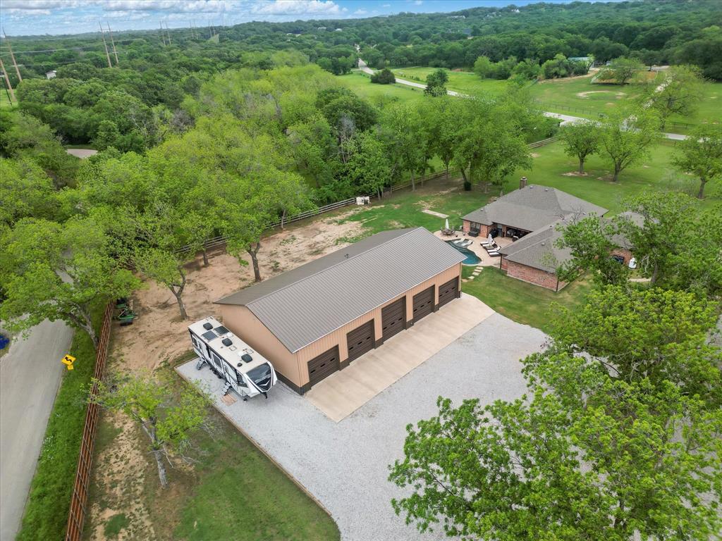 5657 Harmony Ranch Road Aubrey, TX 76227 - Photo 38 of 40 an aerial view of a house with a yard and lake view