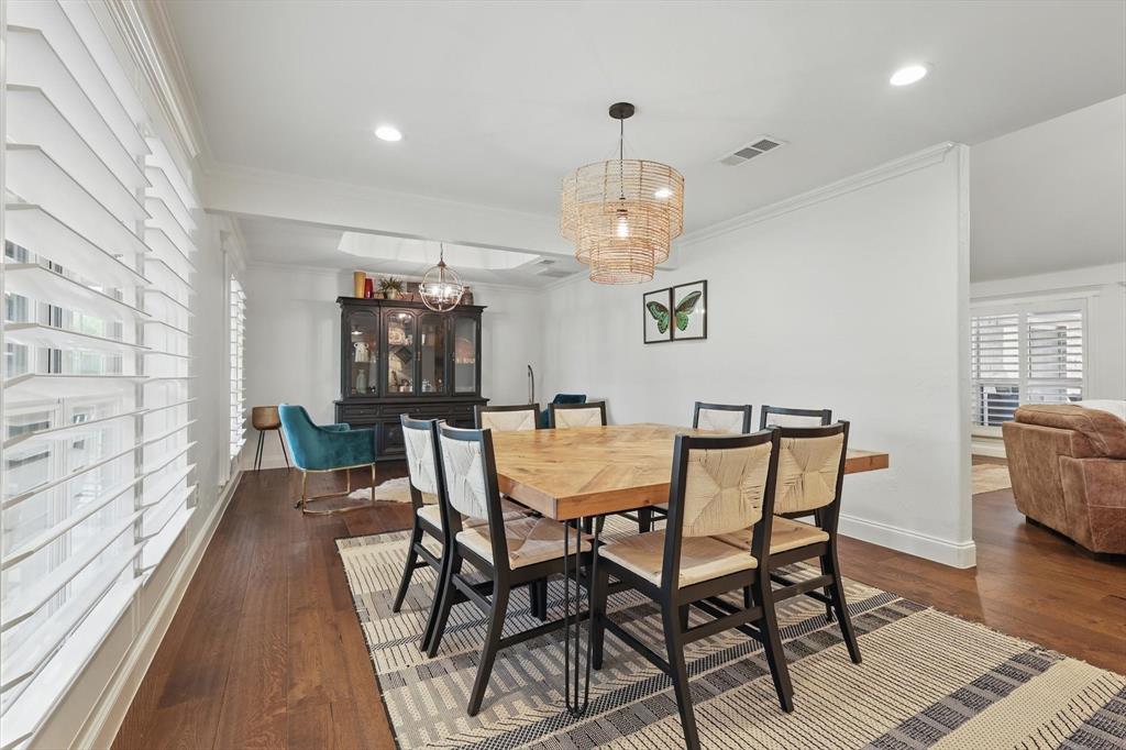 5657 Harmony Ranch Road Aubrey, TX 76227 - Photo 6 of 40 a view of a dining room with furniture and wooden floor