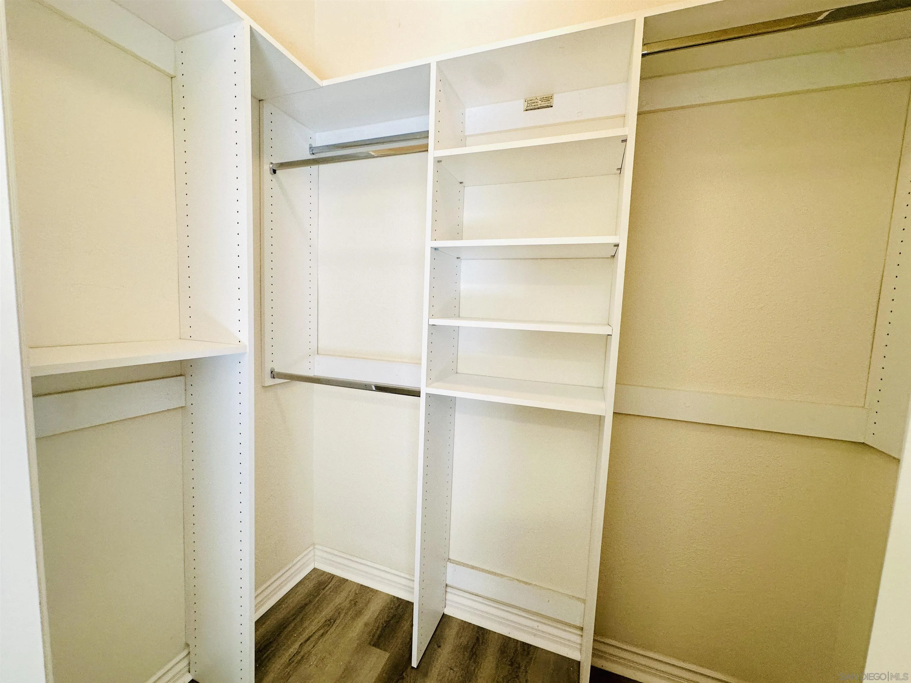 9263 Regents Road, Unit B204 La Jolla, CA 92037 - Photo 10 of 17 a walk in closet with wooden floor