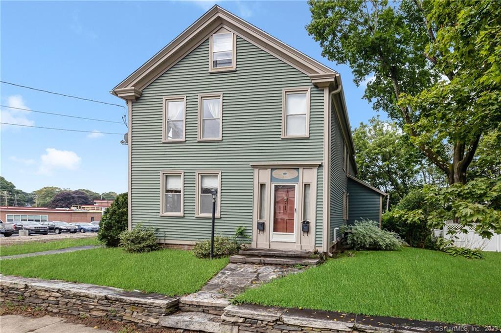 375 Main Street Killingly, CT 06239 - Photo 1 of 1 a front view of a house with a yard and garage