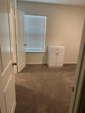 a view of a room that has a window in it