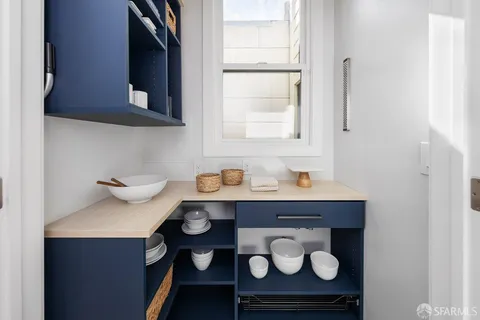 a bathroom with a sink mirror and shower