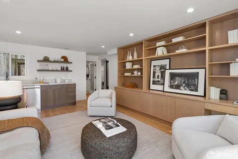 a kitchen with stainless steel appliances granite countertop a sink and wooden cabinets