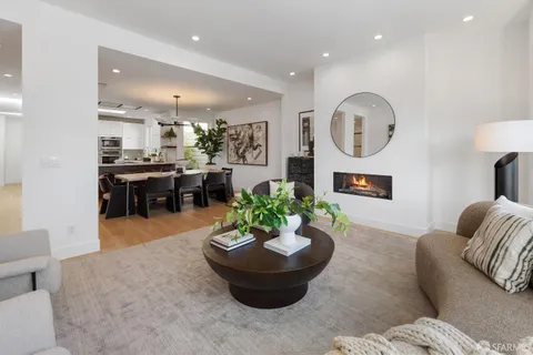 a dining room with wooden floor and breakfast area