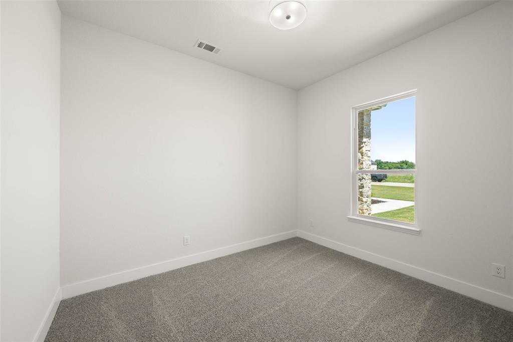221 Olson Road Waxahachie, TX 75167 - Photo 13 of 24 an empty room with a window