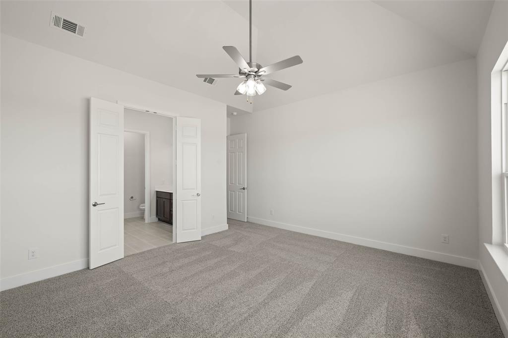 221 Olson Road Waxahachie, TX 75167 - Photo 19 of 24 wooden floor in an empty room with a fan