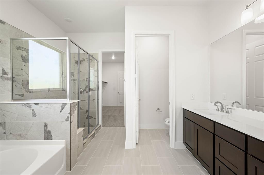 221 Olson Road Waxahachie, TX 75167 - Photo 20 of 24 a bathroom with a tub sink shower and two mirror